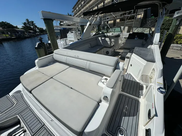  Yacht Photos Pics 2020 Sea Ray SDX 290 Outboard boat with spacious seating and sleek design at a marina.
