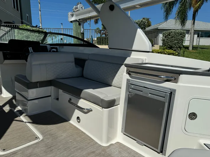  Yacht Photos Pics Interior of 2020 Sea Ray SDX 290 Outboard boat with seating and mini fridge.