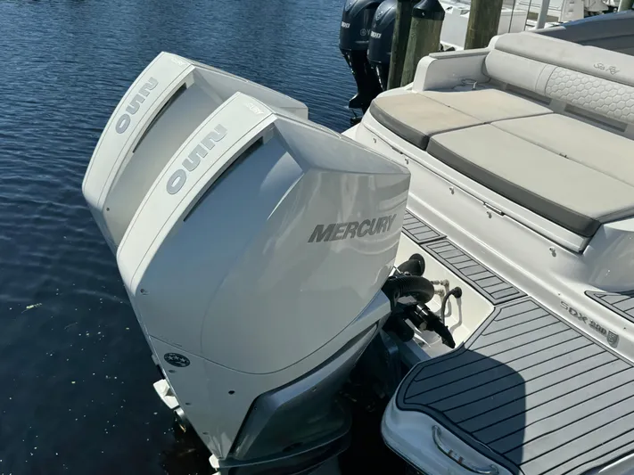  Yacht Photos Pics 2020 Sea Ray SDX 290 Outboard with twin Mercury engines, docked on calm water.