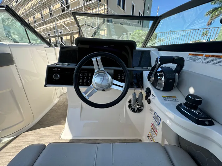  Yacht Photos Pics 2020 Sea Ray SDX 290 Outboard helm with steering wheel and controls.