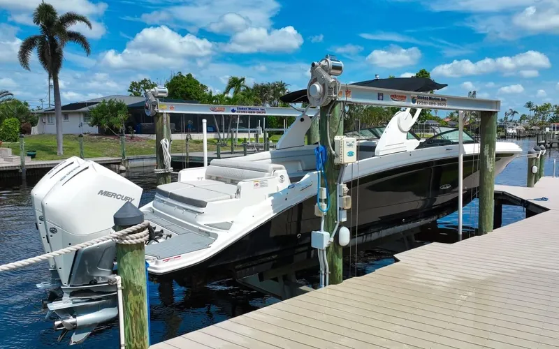  Yacht Photos Pics 2020 Sea Ray SDX 290 Outboard boat docked under sunny skies.
