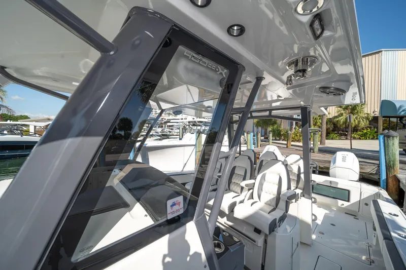  Yacht Photos Pics 2022 World Cat 400 CC-X boat interior with modern seating and sleek design.