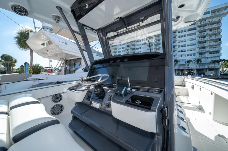  Yacht Photos Pics 2022 World Cat 400 CC-X boat cockpit with modern controls and seating.