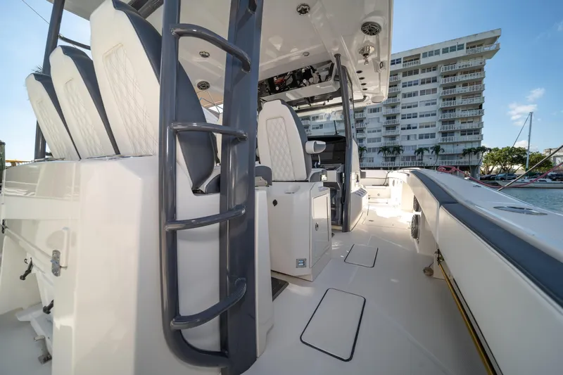  Yacht Photos Pics 2022 World Cat 400 CC-X boat interior with modern seating and sleek design.