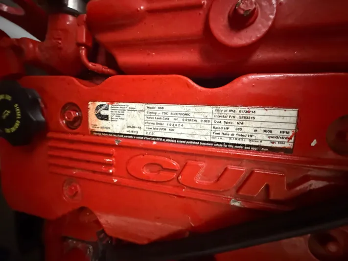 Wrangler Yacht Photos Pics Close-up of Cummins engine label on red engine block.