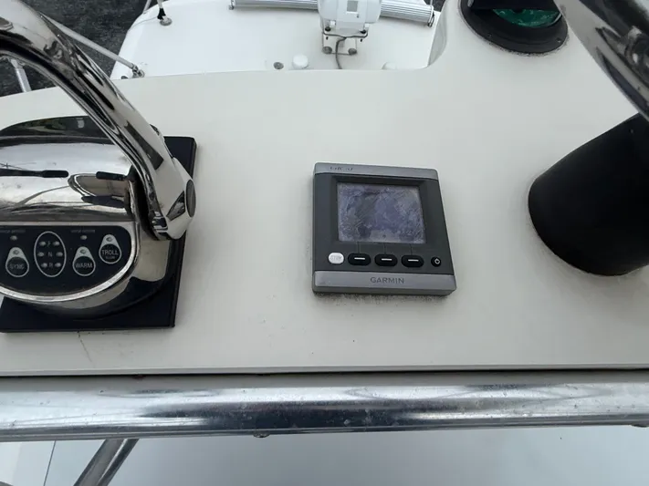 Wrangler Yacht Photos Pics Garmin device on dashboard of a 2003 Pursuit 3400 Express boat.
