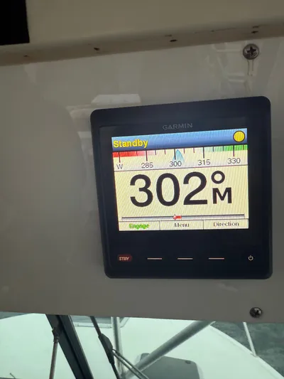 Wrangler Yacht Photos Pics Garmin display on Pursuit 3400 Express boat, heading 302 degrees.
