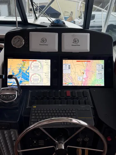 Wrangler Yacht Photos Pics Pursuit 3400 Express 2003 helm with navigation system.