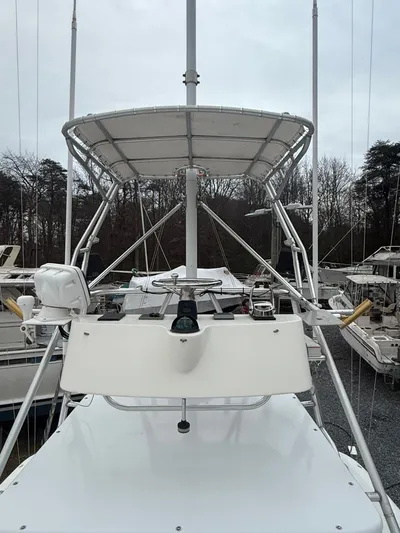 Wrangler Yacht Photos Pics 2003 Pursuit 3400 Express boat with helm and radar.