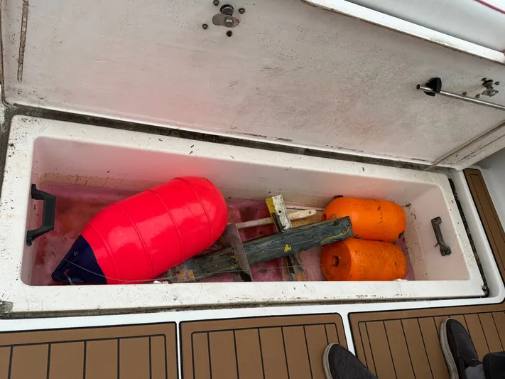 Wrangler Yacht Photos Pics Storage compartment in Pursuit 3400 Express boat with buoys, 2003 model.