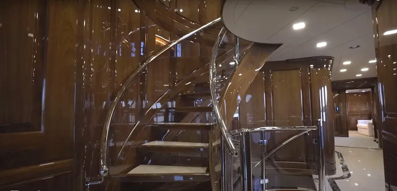 Jackpot Yacht Photos Pics Luxurious interior of Christensen Model Year 2020 yacht with elegant spiral staircase.