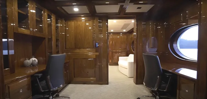 Jackpot Yacht Photos Pics Luxurious Christensen yacht interior, Model Year 2020, featuring polished wood and modern furnishings.