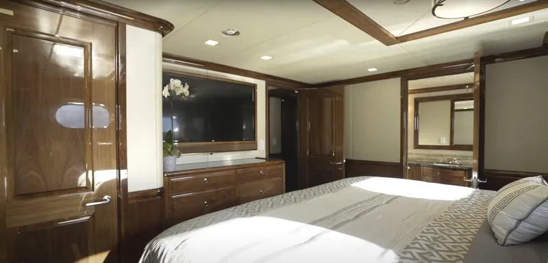 Jackpot Yacht Photos Pics Luxurious bedroom interior of Christensen Model Year 2020 yacht with wooden furnishings.