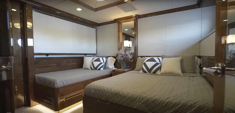 Jackpot Yacht Photos Pics Luxurious bedroom interior of Christensen Model Year 2020 yacht with modern decor and comfortable bedding.
