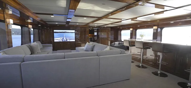 Jackpot Yacht Photos Pics Luxurious interior of Christensen Model Year 2020 yacht with spacious seating and bar area.