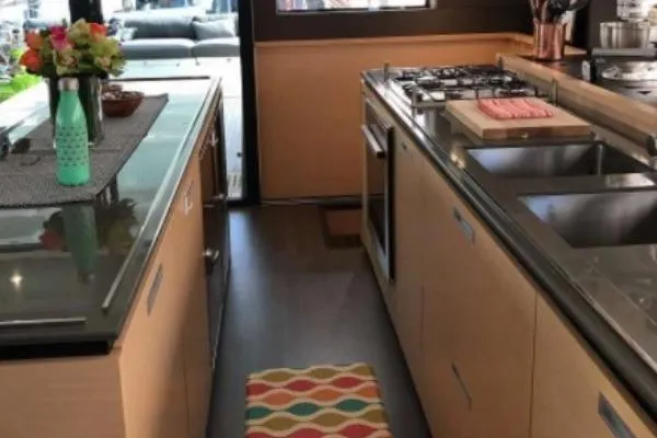 Lena Yacht Photos Pics Modern kitchen interior of 2017 Lagoon 63 Power yacht with sleek countertops and appliances.