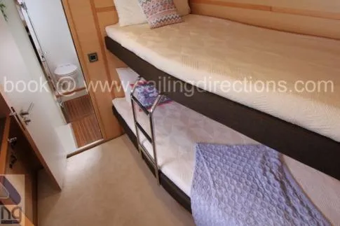 Lena Yacht Photos Pics Bunk beds in 2017 Lagoon 63 Power yacht cabin with bathroom view.
