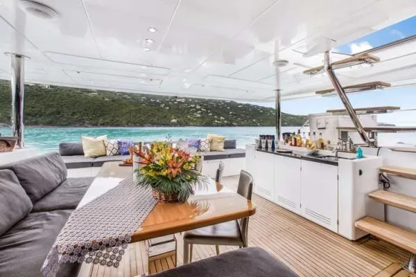 Lena Yacht Photos Pics Luxurious 2017 Lagoon 63 Power yacht interior with elegant seating, dining area, and scenic ocean view.