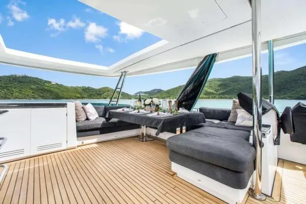 Lena Yacht Photos Pics Luxurious 2017 Lagoon 63 Power yacht interior with elegant seating and scenic ocean view.