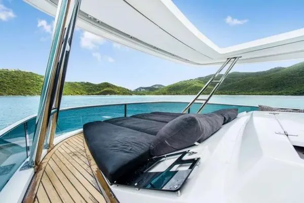 Lena Yacht Photos Pics Luxurious 2017 Lagoon 63 Power yacht with sunbathing deck, scenic ocean view.