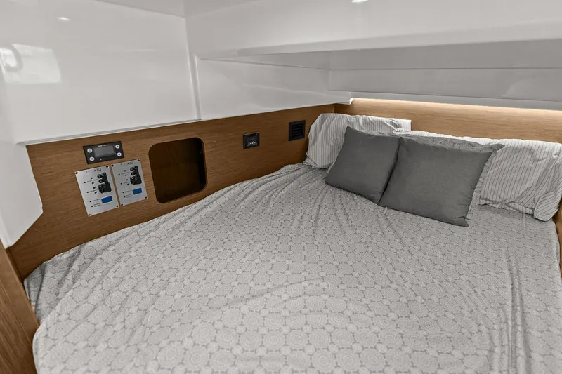Trinity Yacht Photos Pics Cozy cabin bed in 2020 Jeanneau NC 1095 Fly yacht with modern controls.