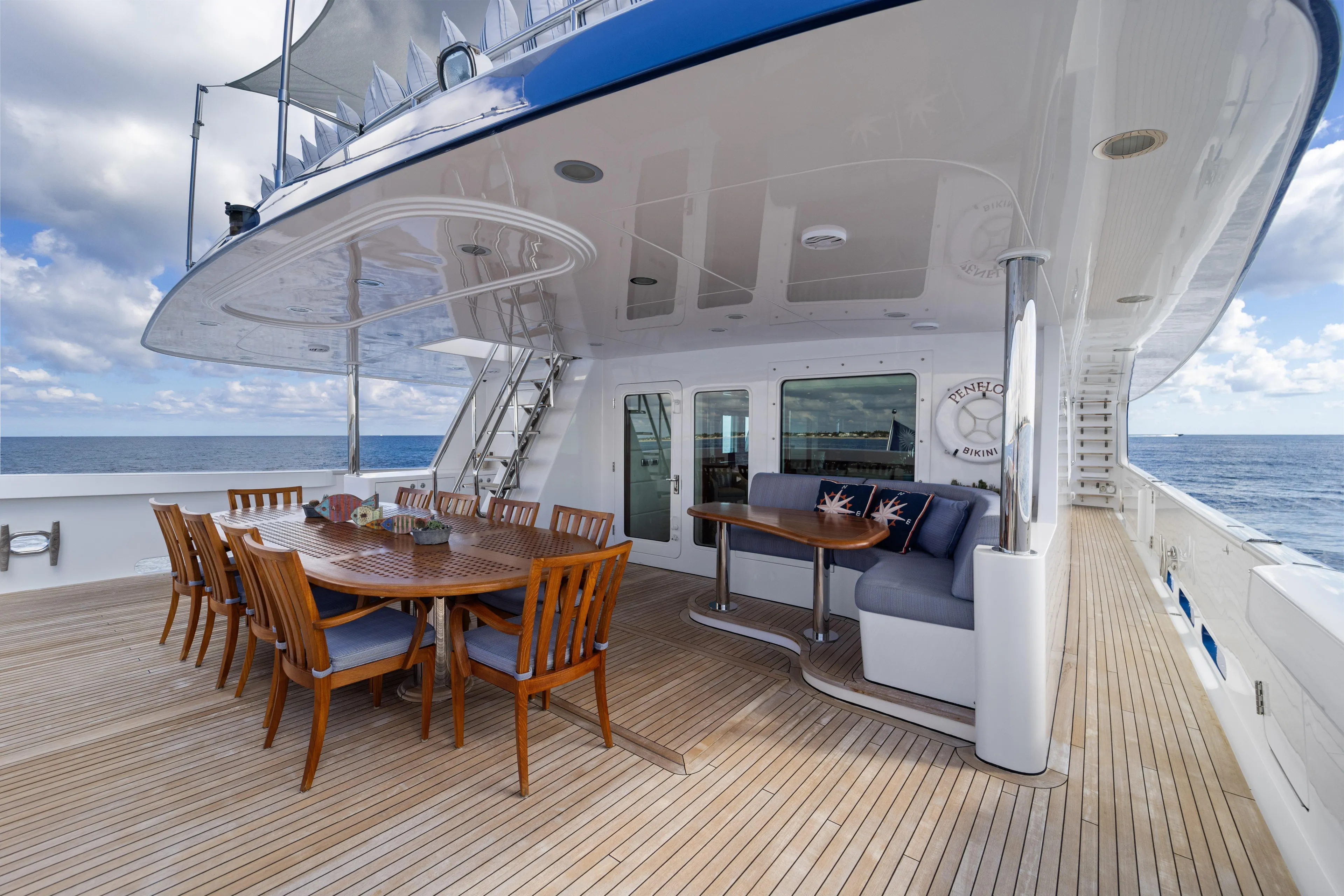 Penelope Yacht Photos Pics Luxurious 1990 Delta Expedition yacht deck with dining area and ocean view.