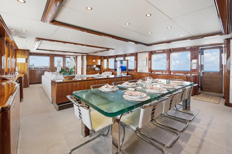 Penelope Yacht Photos Pics Luxurious dining area on 1990 Delta Expedition yacht with elegant table setting and panoramic windows.