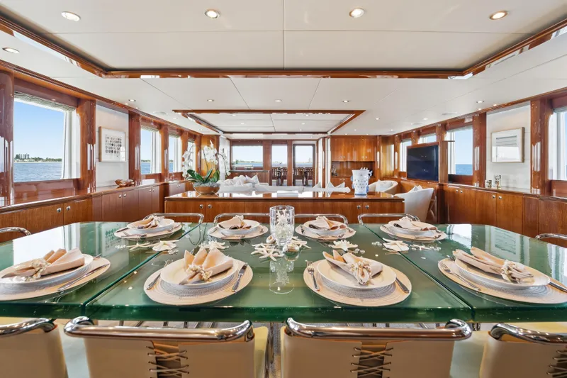Penelope Yacht Photos Pics Luxurious dining area on 1990 Delta Expedition yacht with elegant table setting and ocean view.