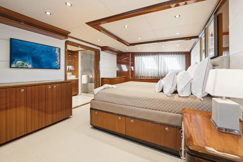 Penelope Yacht Photos Pics Luxurious 1990 Delta Expedition yacht bedroom with elegant wood finishes and modern amenities.