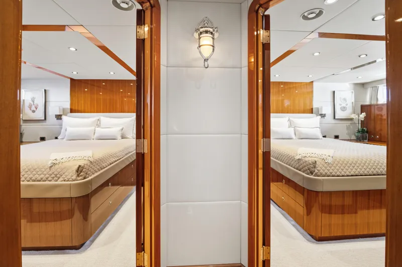 Penelope Yacht Photos Pics Luxurious 1990 Delta Expedition yacht interior with elegant twin bedrooms and polished wood finishes.
