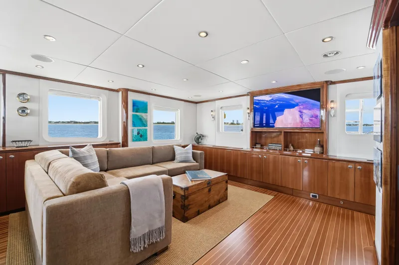 Penelope Yacht Photos Pics Luxurious 1990 Delta Expedition yacht interior with plush seating, wooden accents, and ocean views.