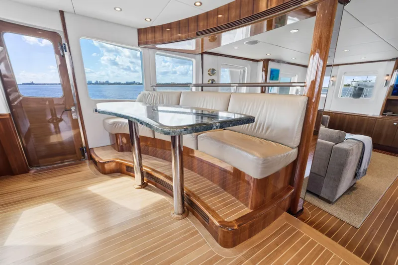 Penelope Yacht Photos Pics Luxurious 1990 Delta Expedition yacht interior with elegant wood finishes and ocean view.