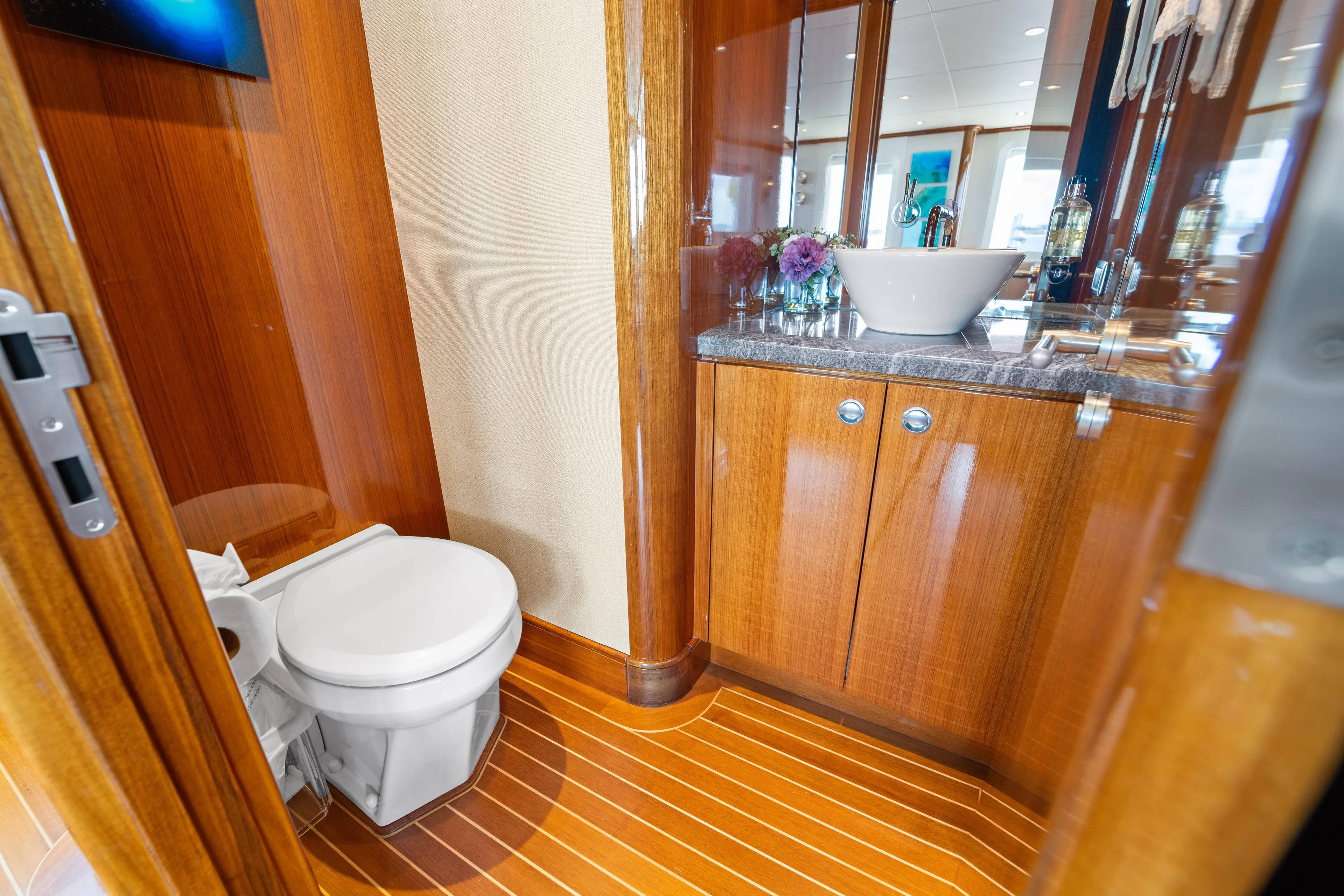 Penelope Yacht Photos Pics Luxurious 1990 Delta Expedition yacht bathroom with wooden cabinetry and modern fixtures.