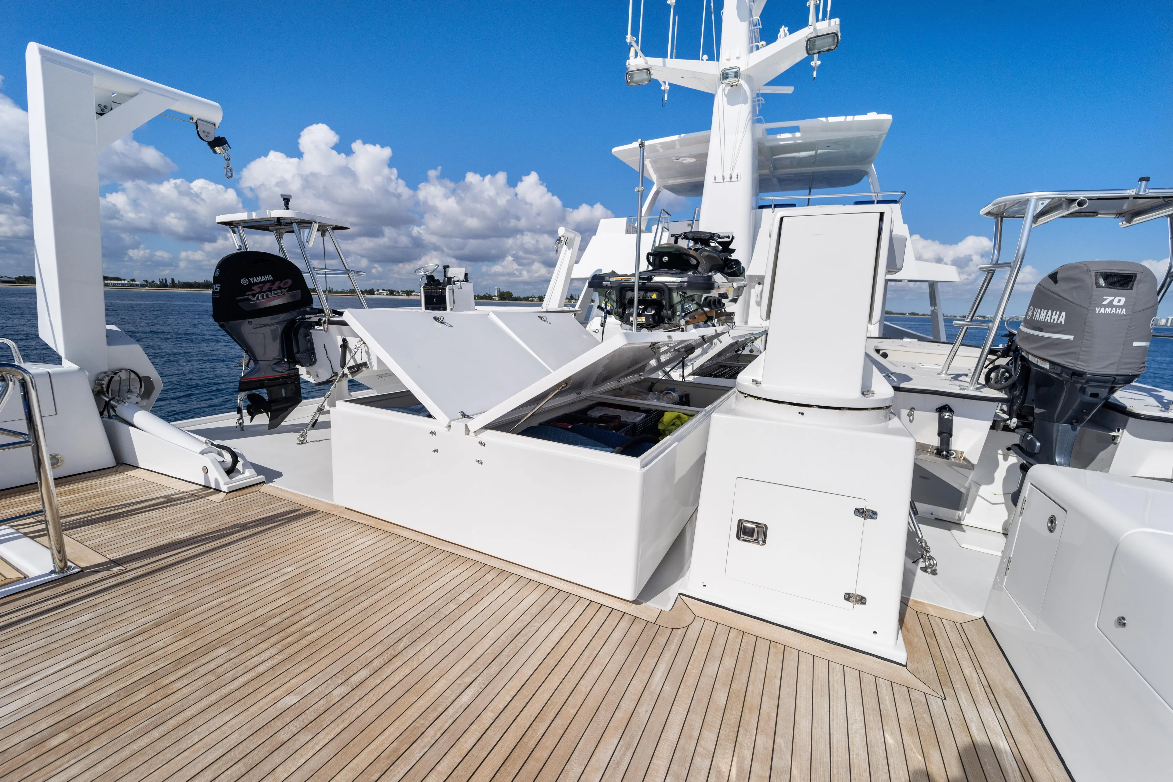 Penelope Yacht Photos Pics 1990 Delta Expedition yacht deck with Yamaha outboard motors and storage compartments.