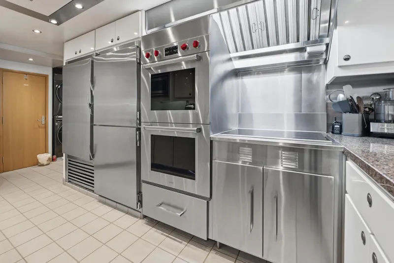 Penelope Yacht Photos Pics Modern stainless steel kitchen appliances in a sleek, professional setting, Delta Expedition 1990 model.