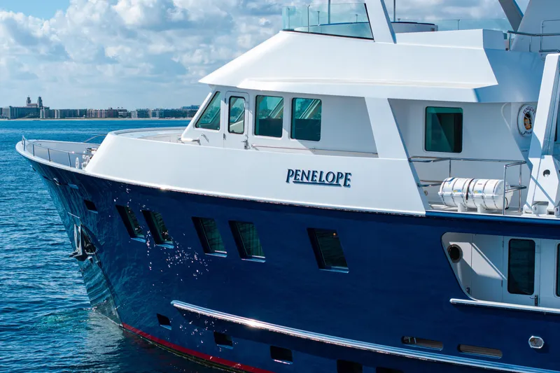 Penelope Yacht Photos Pics Luxury yacht "Penelope" on water, Delta Expedition 1990 model, clear sky background.