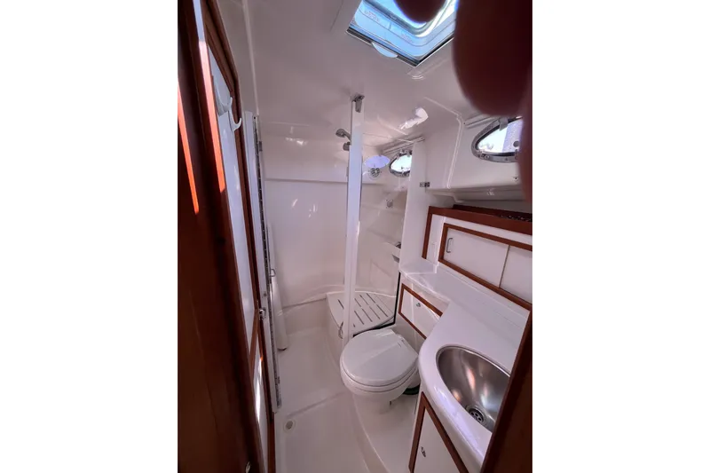 Phalarope Yacht Photos Pics 2017 Back Cove 37 yacht bathroom with shower, sink, and toilet.