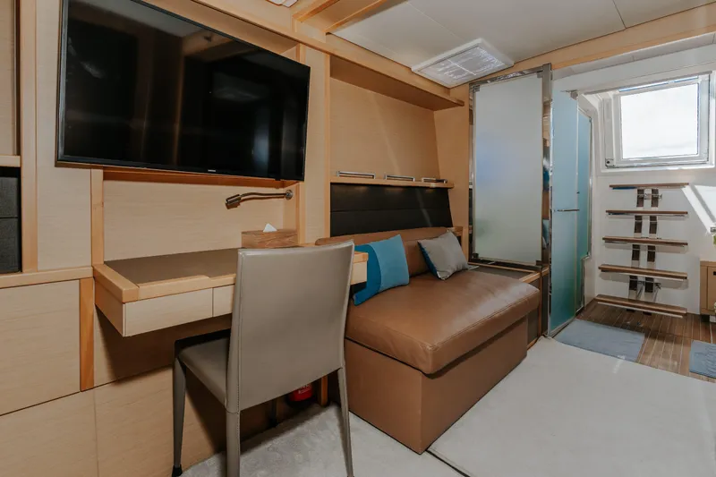  Yacht Photos Pics Luxurious interior of 2017 Lagoon 630 Motor Yacht with modern furnishings and TV.