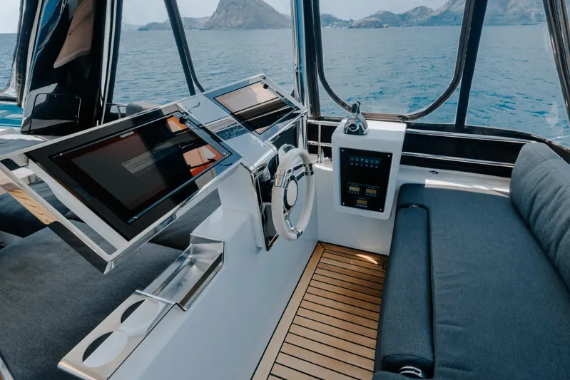  Yacht Photos Pics Luxurious helm of 2017 Lagoon 630 Motor Yacht with modern controls and ocean view.