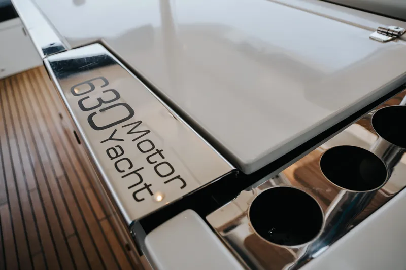  Yacht Photos Pics Close-up of 2017 Lagoon 630 Motor Yacht deck with logo and cup holders.