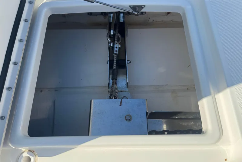  Yacht Photos Pics Anchor compartment of 2021 World Cat 400 DC-X boat, featuring metal components and cables.