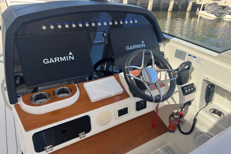  Yacht Photos Pics Helm of 2021 World Cat 400 DC-X with Garmin displays and steering wheel.