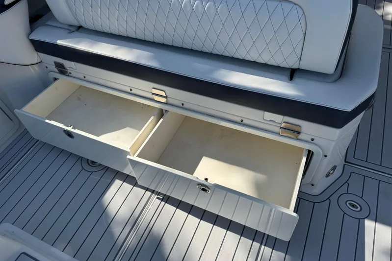  Yacht Photos Pics World Cat 400 DC-X 2021 boat interior with open storage drawers and cushioned seating.