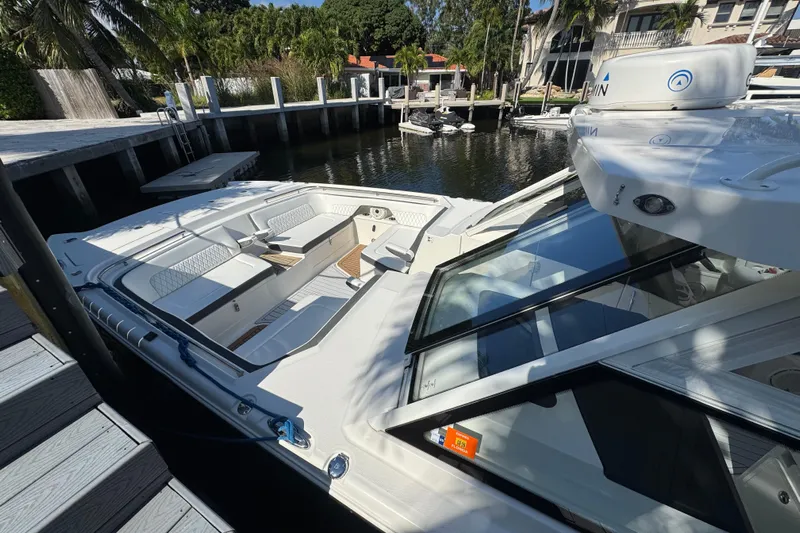 Yacht Photos Pics 2021 World Cat 400 DC-X boat docked, featuring spacious seating and sleek design.