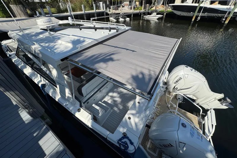  Yacht Photos Pics 2021 World Cat 400 DC-X boat docked with Yamaha engines and sunshade.