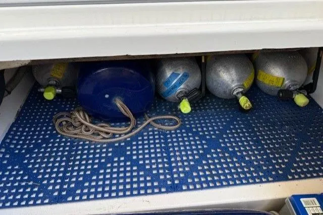  Yacht Photos Pics Storage compartment with scuba tanks and rope on a World Cat 400 DC-X boat, 2021 model.