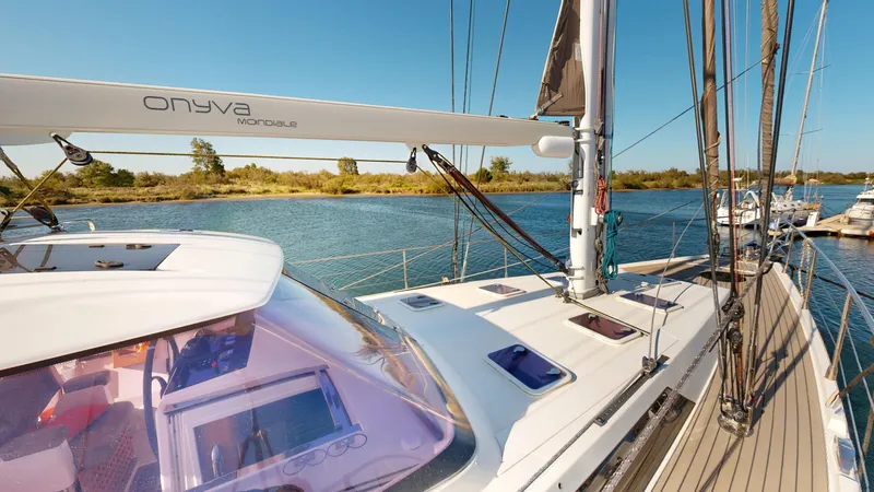  Yacht Photos Pics Sailing yacht Amel 55, 2011 model, on calm waters with clear blue sky.