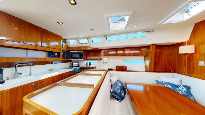  Yacht Photos Pics Luxurious interior of 2011 Amel 55 yacht with modern kitchen and dining area.