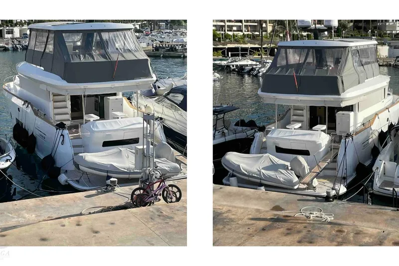  Yacht Photos Pics 2022 Sirena 58 yacht docked at marina, featuring covered upper deck and moored alongside other boats.