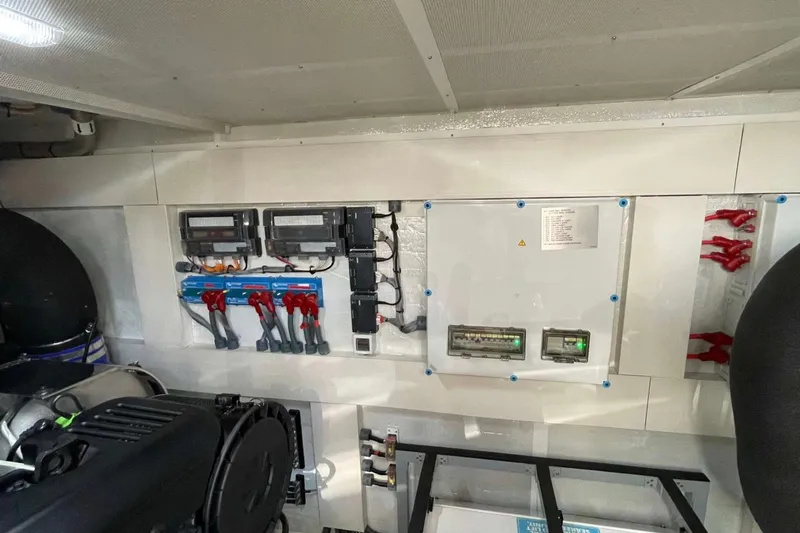  Yacht Photos Pics Engine room of 2022 Sirena 58 yacht, featuring electrical panels and wiring systems.